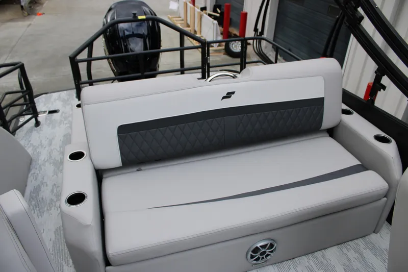 Slide: The Image of 2026 Starcraft SLS 3 Q DH boat interior with cushioned seating and cup holders. - 11