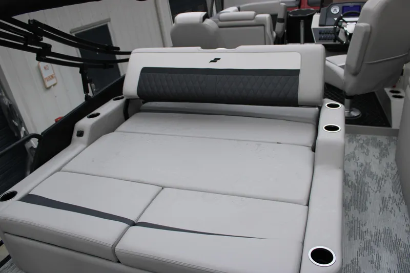 Slide: The Image of Luxurious seating on 2026 Starcraft SLS 3 Q DH boat, featuring cup holders and modern design. - 13