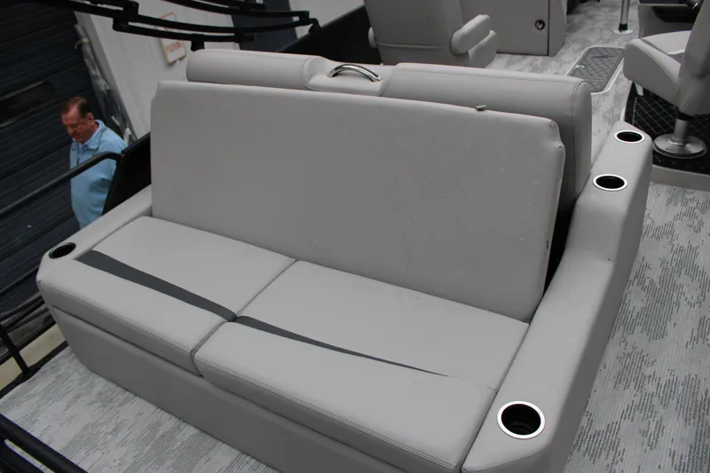 Slide: The Image of 2026 Starcraft SLS 3 Q DH boat interior with gray seating and cup holders. - 16