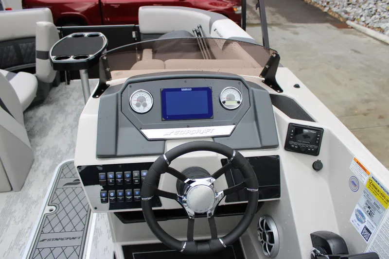 Slide: The Image of 2026 Starcraft SLS 3 Q DH boat dashboard with steering wheel and control panel. - 8