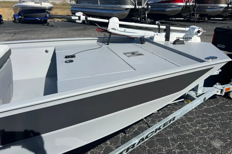 Slide: The Image of 2026 Tracker Bass Tracker Classic CC boat on trailer, featuring Minn Kota trolling motor. - 52