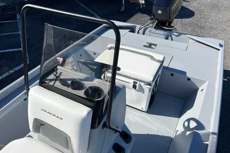 Slide: The Image of 2026 Tracker Bass Tracker Classic CC boat interior with steering console and seating. - 56