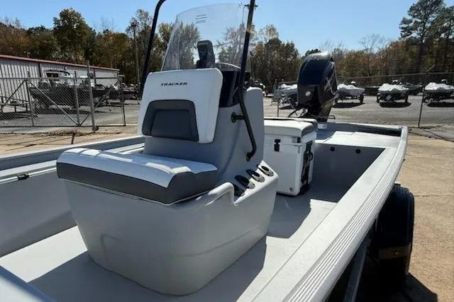 Slide: The Image of 2026 Tracker Bass Tracker Classic CC boat with center console in a marina setting. - 5