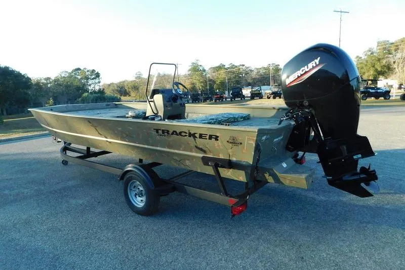 Slide: The Image of 2024 Tracker Grizzly 2072 CC boat with Mercury outboard motor on trailer. - 4