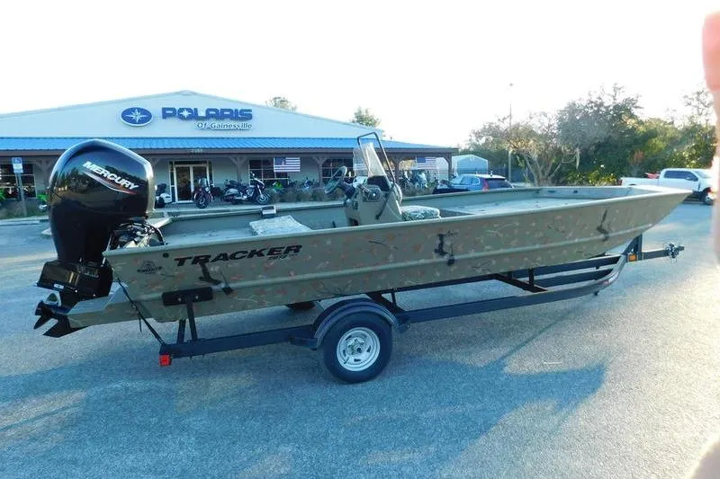 Slide: The Image of 2024 Tracker Grizzly 2072 CC boat on trailer outside dealership. - 6