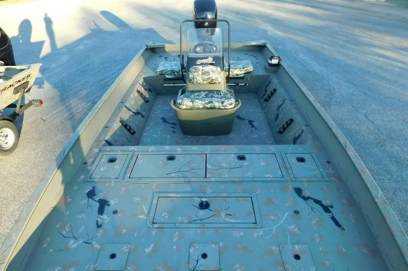 Slide: The Image of 2024 Tracker Grizzly 2072 CC boat with camouflage interior design. - 7