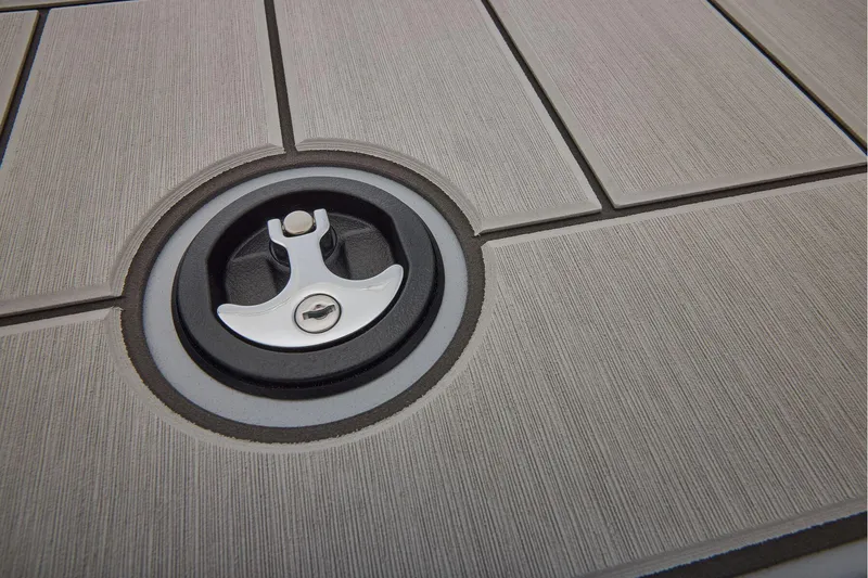 Slide: The Image of 2026 Tracker Bass Tracker Classic CC deck with circular latch detail. - 19