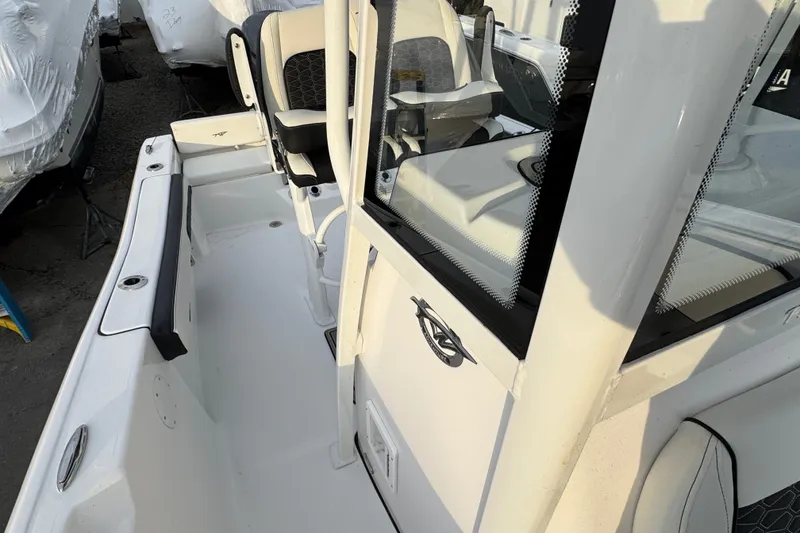 Slide: The Image of 2026 Tidewater 198 CC Adventure boat interior with seating and console details. - 14