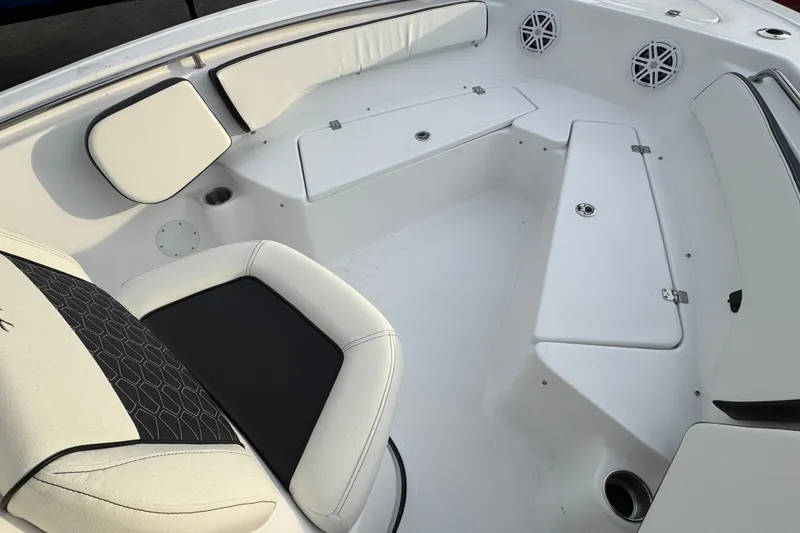 Slide: The Image of 2026 Tidewater 198 CC Adventure boat interior with white seating and storage compartments. - 15