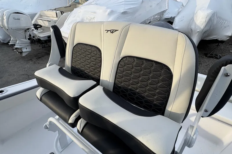 Slide: The Image of 2026 Tidewater 198 CC Adventure boat seats with black and white upholstery. - 4