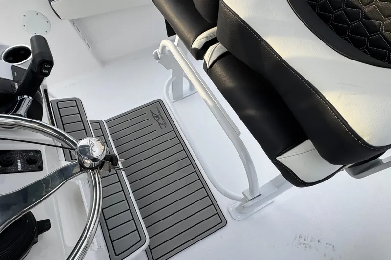 Slide: The Image of Steering wheel and seating of 2026 Tidewater 198 CC Adventure boat interior. - 5