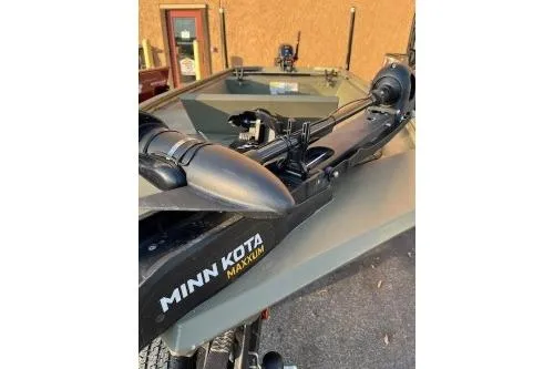 Slide: The Image of 2022 Tracker Grizzly 1648 AWL boat with Minn Kota Maxxum trolling motor. - 5