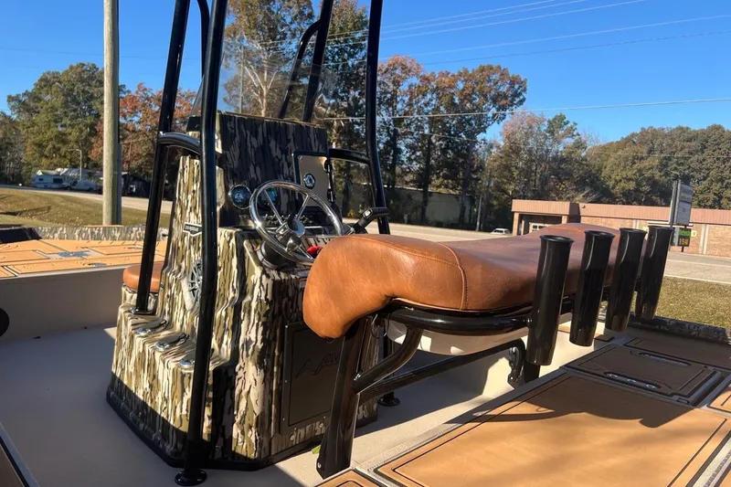 Slide: The Image of 2026 Avid 20 ROGUE CC boat with camo console and leather seating. - 8