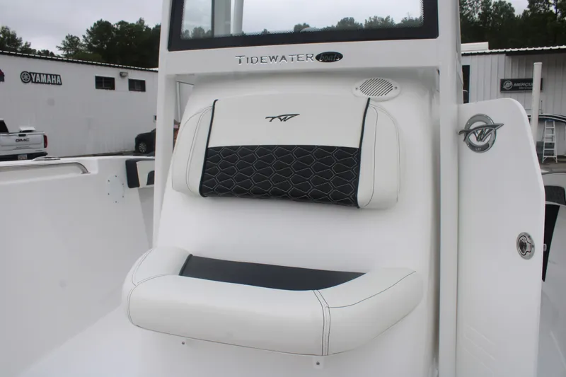 Slide: The Image of 2026 Tidewater 210 LXF boat seat with black and white upholstery detail. - 11