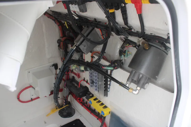 Slide: The Image of Electrical wiring and components inside a 2026 Tidewater 210 LXF boat. - 19