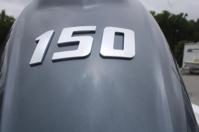 Slide: The Image of Close-up of a 150 horsepower engine on a 2026 Tidewater 210 LXF boat. - 21