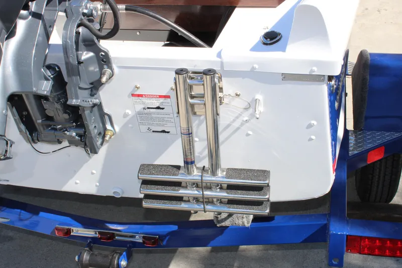 Slide: The Image of Rear view of 2026 Starcraft 57 Ski Champ boat with motor and ladder. - 10