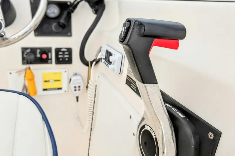 Slide: The Image of 2003 Palm Beach 22 Dual Console boat controls and throttle lever. - 11
