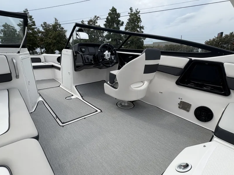 Slide: The Image of 2024 Yamaha Boats AR 195 interior, featuring sleek design and modern seating arrangement. - 12