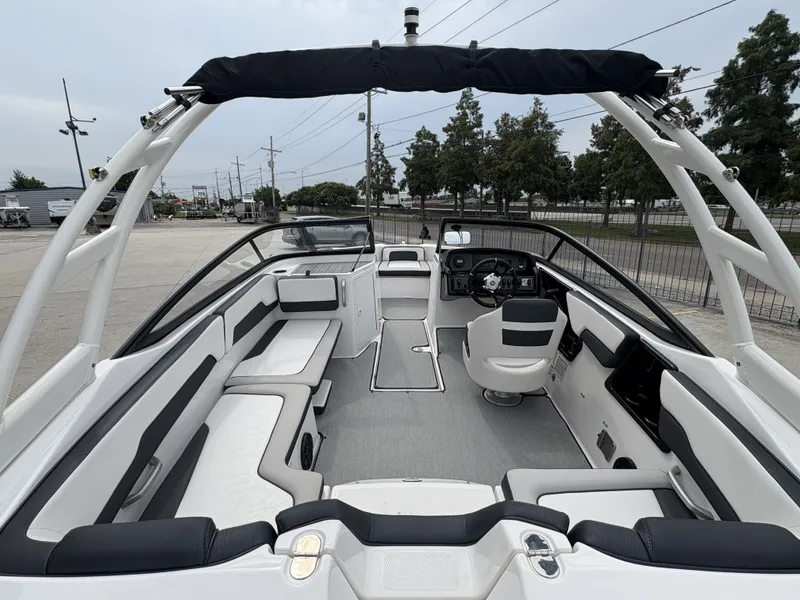 Slide: The Image of 2024 Yamaha Boats AR 195 interior, featuring sleek seating and modern dashboard design. - 9