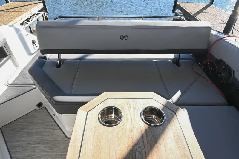 Slide: The Image of Luxurious seating area on 2024 Cobalt R8 boat with cushion and table. - 17