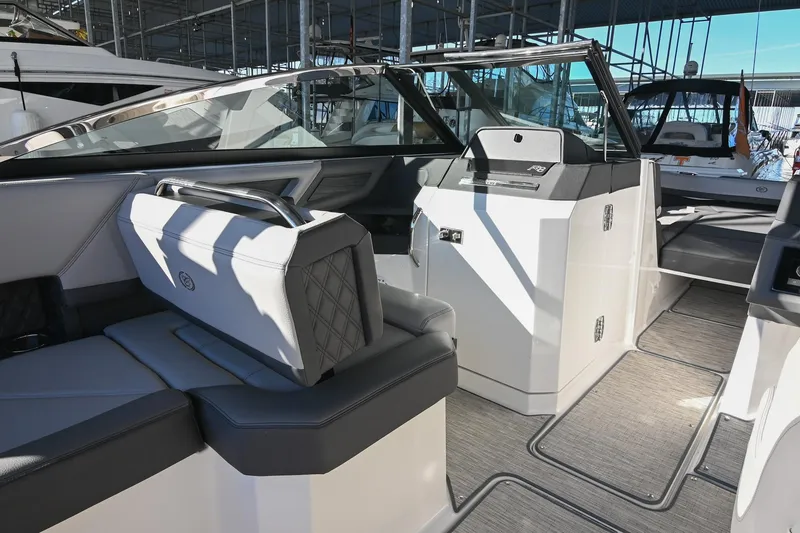 Slide: The Image of Luxurious interior of 2024 Cobalt R8 boat with modern seating and steering area. - 23