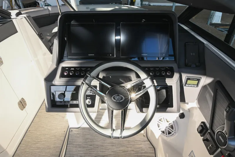 Slide: The Image of 2024 Cobalt R8 boat cockpit with modern steering and control panel. - 30