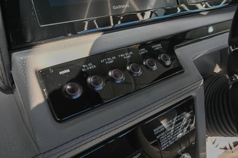 Slide: The Image of 2024 Cobalt R8 boat dashboard with dual screens and modern steering wheel. - 31