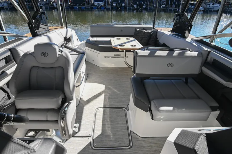 Slide: The Image of 2024 Cobalt R8 boat interior with luxurious captain's chair and modern controls. - 35