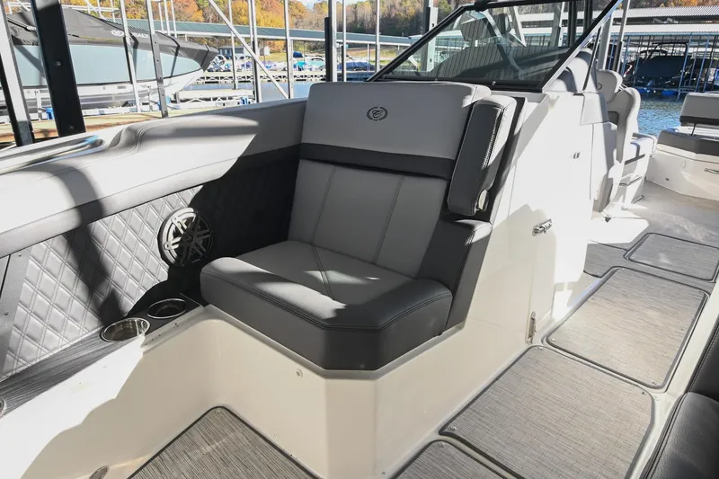 Slide: The Image of 2024 Cobalt R8 boat interior with luxurious gray seating and speaker detail. - 41