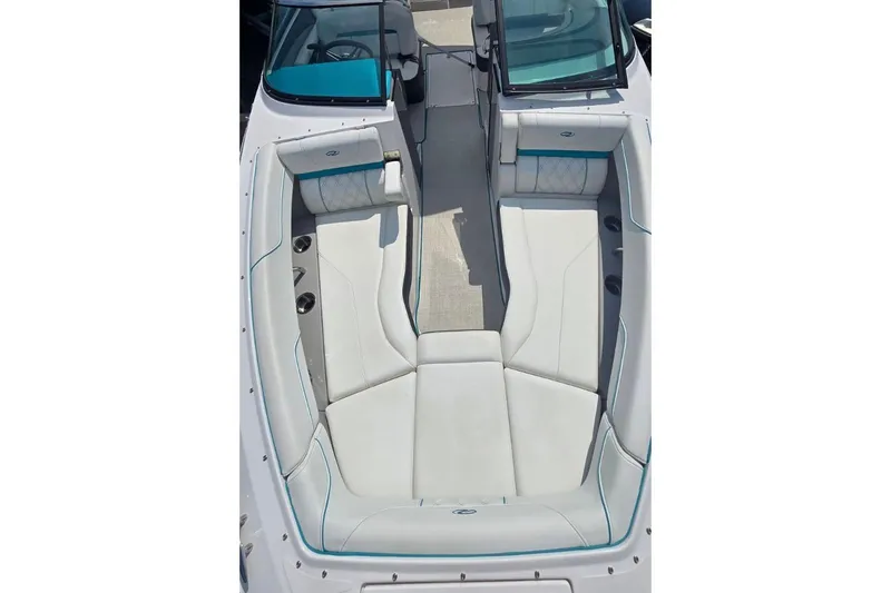 Slide: The Image of 2020 Regal LS6 boat interior with white seating and teal accents. - 8