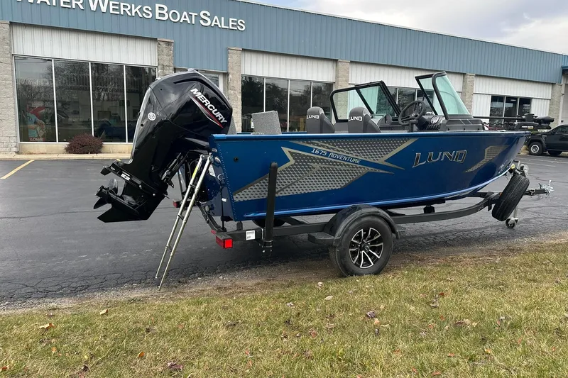 Slide: The Image of 2026 Lund 1675 Adventure Sport boat displayed at Water Werks Boat Sales dealership. - 1