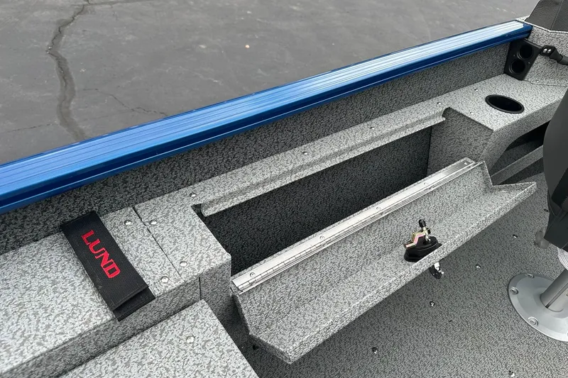 Slide: The Image of Interior view of 2026 Lund 1675 Adventure Sport boat, featuring storage and seating. - 17