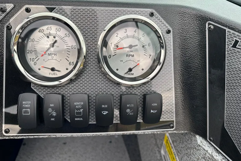 Slide: The Image of Dashboard of 2026 Lund 1675 Adventure Sport with speedometer, RPM gauge, and control switches. - 20