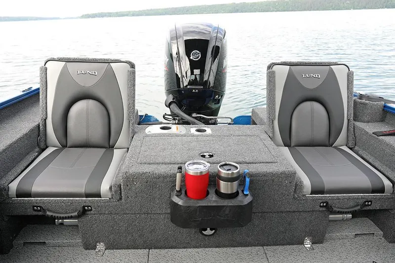 Slide: The Image of Manufacturer Provided Image: 2025 Lund 1675 Adventure Sport boat interior with dual seats and motor on a lake. - 28