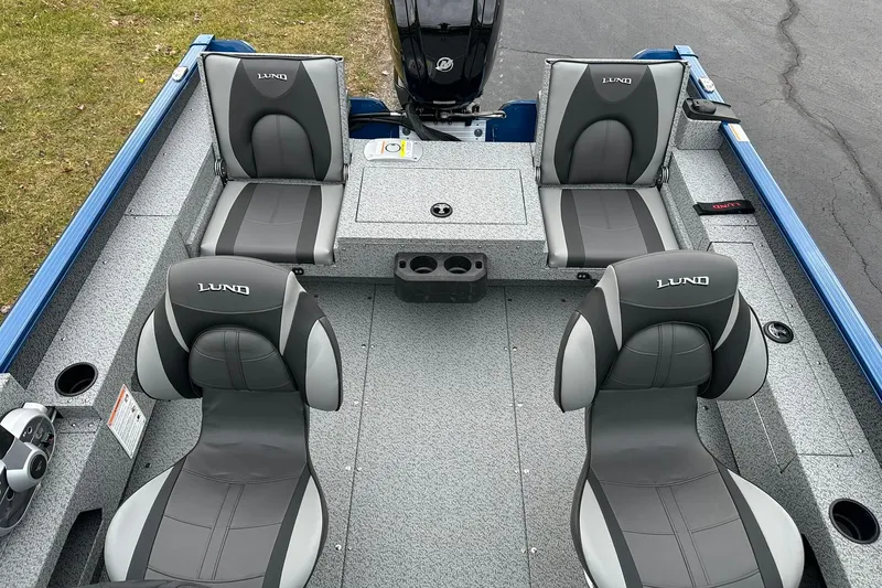 Slide: The Image of 2026 Lund 1675 Adventure Sport boat interior with four gray and black seats. - 7