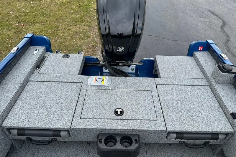 Slide: The Image of 2026 Lund 1675 Adventure Sport boat with motor, featuring spacious deck and storage compartments. - 9