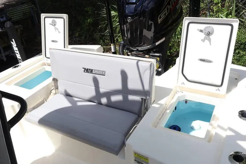Slide: The Image of 2025 Pathfinder 2200 TRS boat interior with seating and storage compartments. - 17