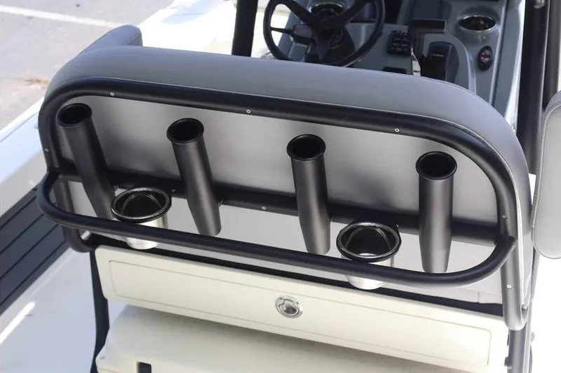 Slide: The Image of 2025 Pathfinder 2200 TRS boat console with rod holders and steering wheel. - 22