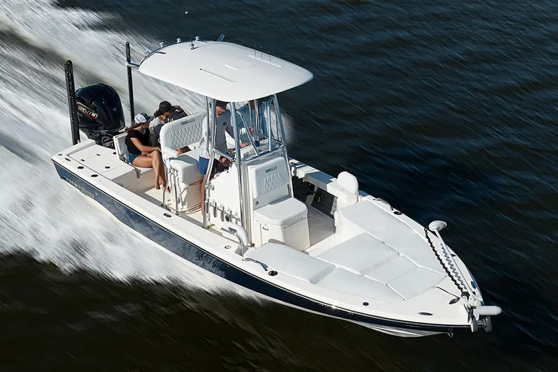 Slide: The Image of Manufacturer Provided Image: 2025 Pathfinder 2200 TRS boat cruising on water, featuring sleek design and powerful engine. - 27