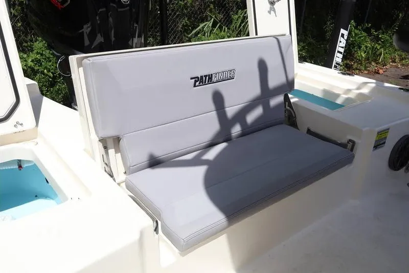 Slide: The Image of 2025 Pathfinder 2200 TRS boat seat with logo, featuring sleek gray upholstery. - 5