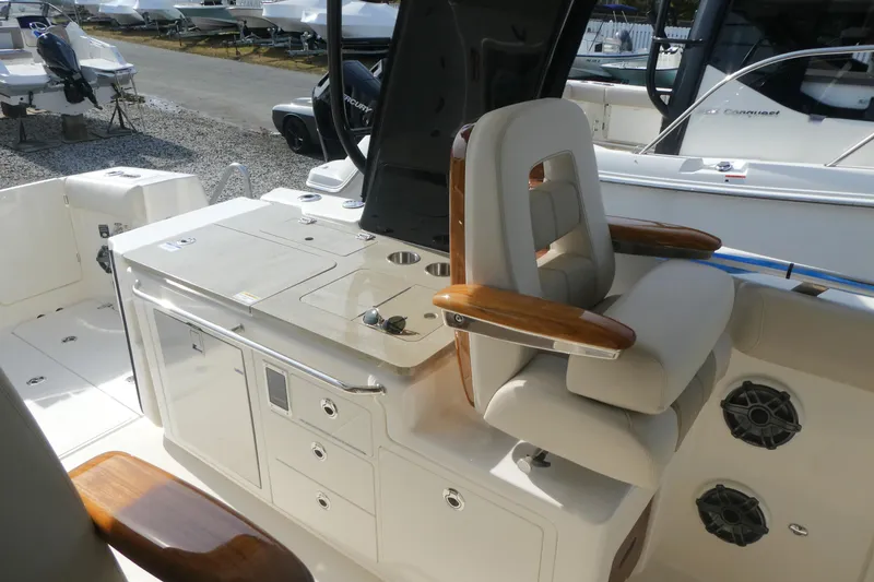 Slide: The Image of 2026 Boston Whaler 380 Realm boat interior with luxurious seating and modern amenities. - 10