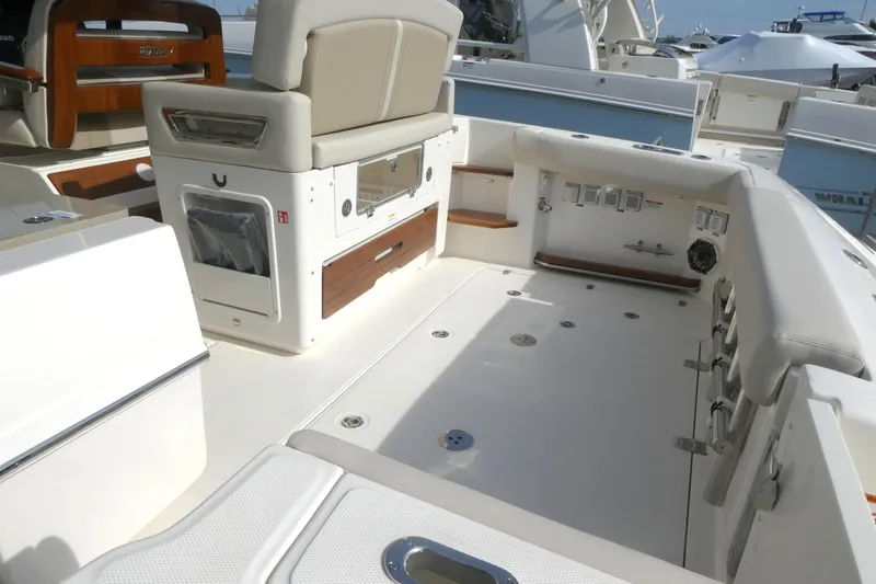Slide: The Image of 2026 Boston Whaler 380 Realm boat interior with seating and storage features. - 4