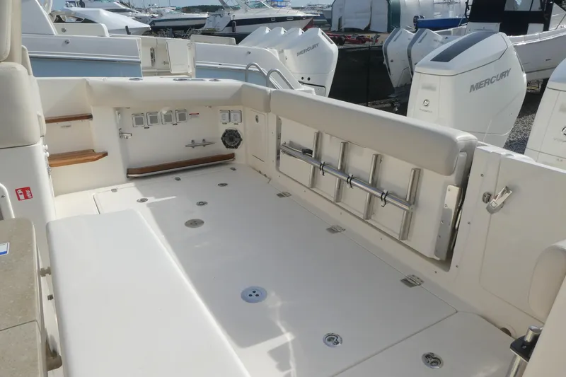 Slide: The Image of 2026 Boston Whaler 380 Realm boat deck with seating and storage features. - 5