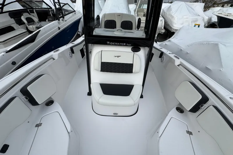 Slide: The Image of 2026 Tidewater 220 LXF boat interior with white seating and modern design. - 13