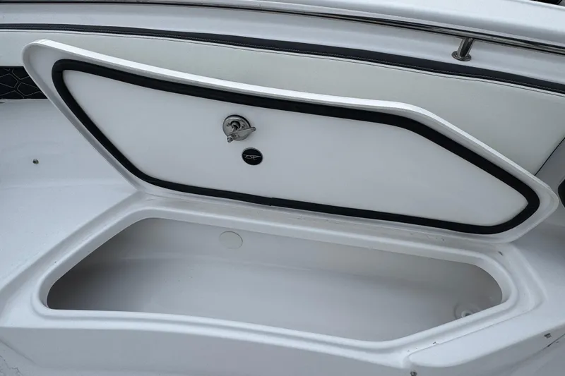 Slide: The Image of Open storage compartment on 2026 Tidewater 220 LXF boat. - 22