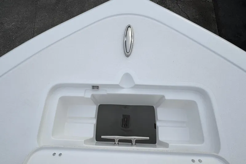 Slide: The Image of 2026 Tidewater 220 LXF boat bow with anchor storage compartment. - 23