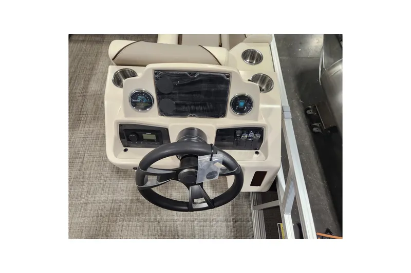 Slide: The Image of 2026 Avalon Venture Versatile Rear Bench boat dashboard with steering wheel and controls. - 10
