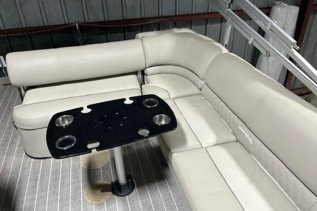 Slide: The Image of 2016 Harris Grand Mariner SEL 250 interior with beige seating and black table. - 10