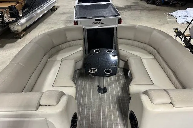 Slide: The Image of 2016 Harris Grand Mariner SEL 250 interior with beige seating and black table. - 12